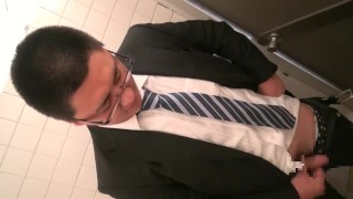 Japanese shy young man businessman shy with outdoor masturbation