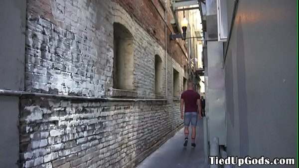 Tied sub restrained outdoors for cocksucking