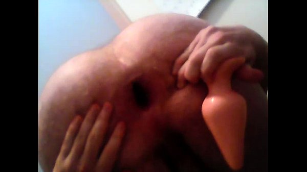 Gay boy playing with buttplug